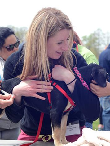 Penn Vet student holding a dog