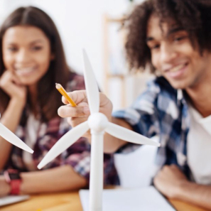 Two students looking at a windmill model