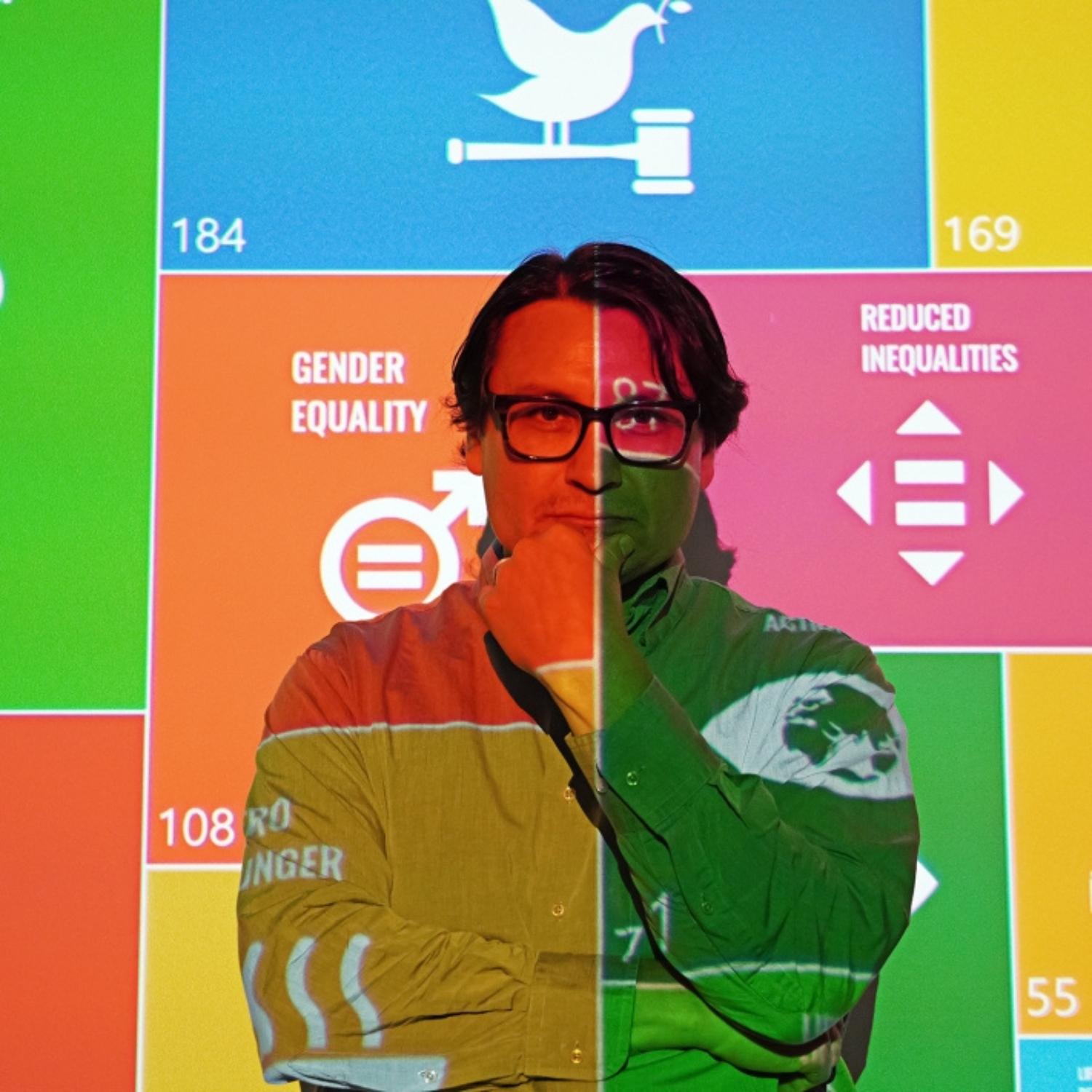 Librarian with image of Sustainable Development Goals projected on his face