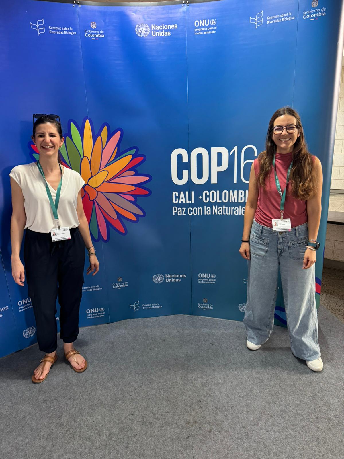 Fernanda Jimenez and Carolina Angel Botero by COP16 banner