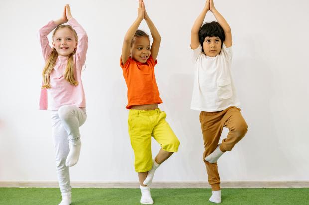 Children doing yoga.