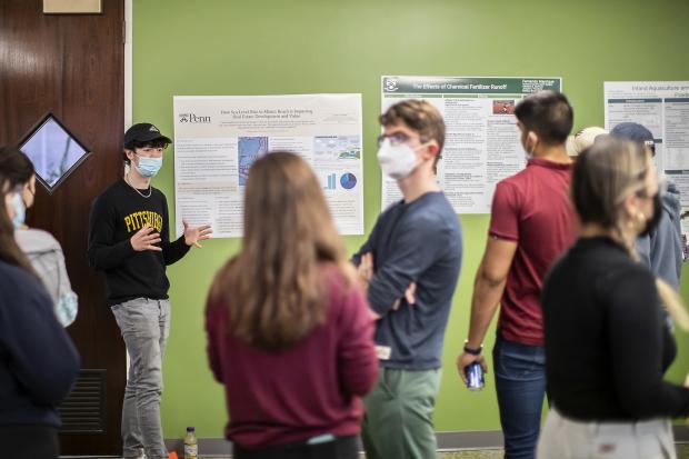 A poster session represented the culmination of the course Humans and the Earth System: How it Works, How We Got Here, and How to Save Our Planet. An introduction to climate change and other environmental challenges, the course navigated a broad range of topics, relying on the expertise of its three professors and several guest speakers.