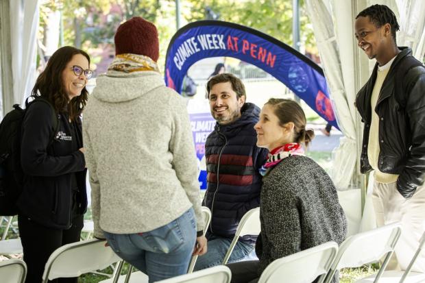 Attendees gather, some sitting, some standing, at a Climate Week 2024 event.