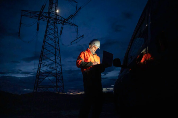 Worker conducting maintenance on critical infrastructure. 