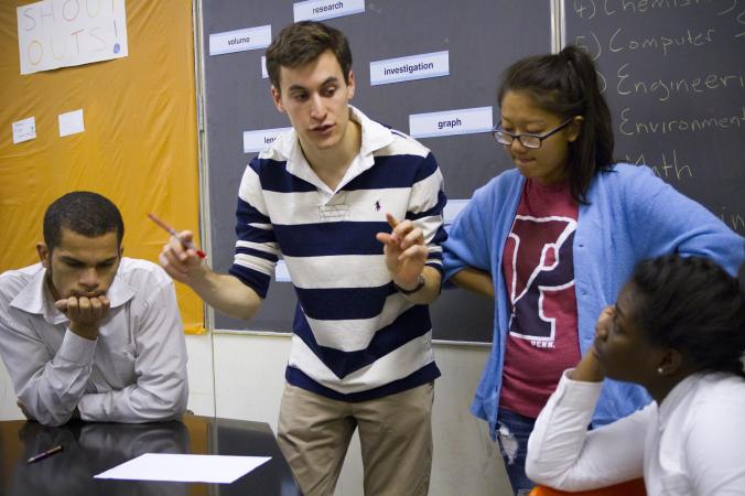 three diverse students presenting