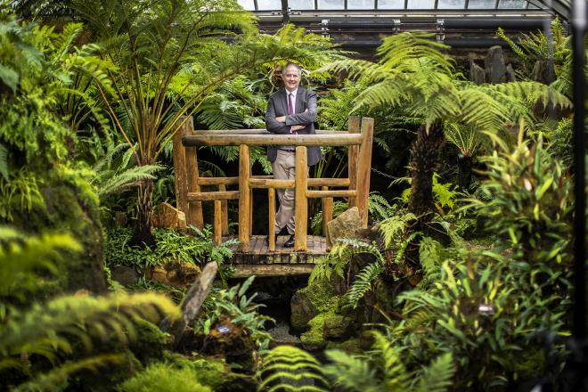 Bill Cullina, director of the Morris Arboretum, poses inside the Arboretum's Victorian fernery in March 2022.