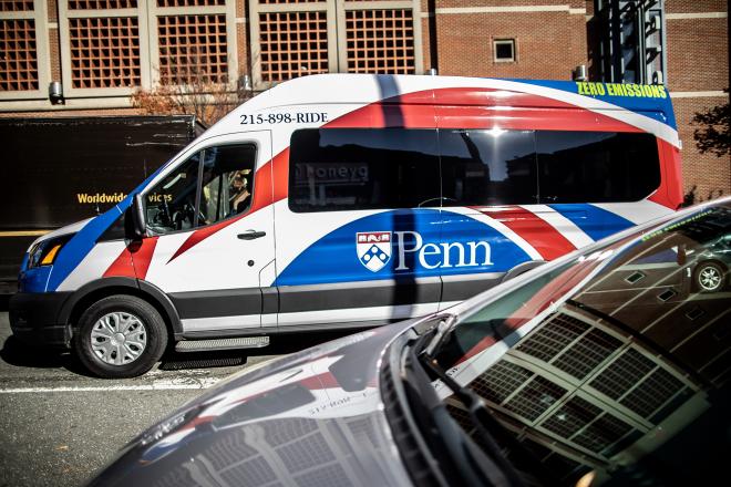 An electric Penn Transit shuttle heading west on Walnut Street.