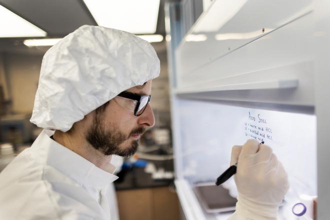 Biogeochemist Jon Hawkings’ lab features a clean room, allowing him and his colleagues a high-tech environment in which to precisely analyze samples collected from the field, investigating how elements released in glacier meltwater affect soil, water, and air. (Image: Eric Sucar)