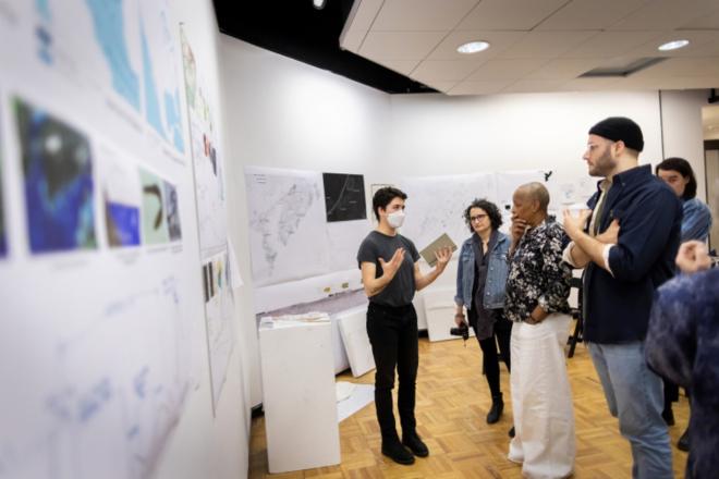 Zoe Kerrich and students in a gallery.