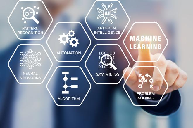 Person points to computer project reading machine learning, AI