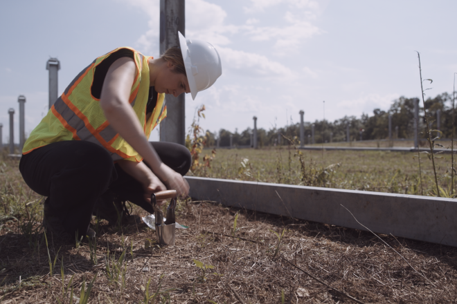 Student Hannah Winn samples soil