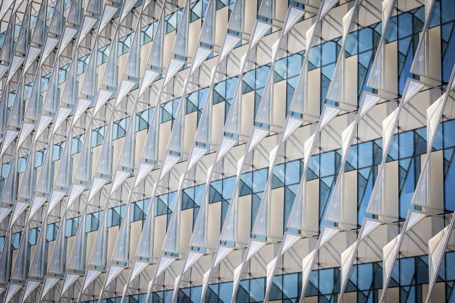 Sun shades attached to building windows.