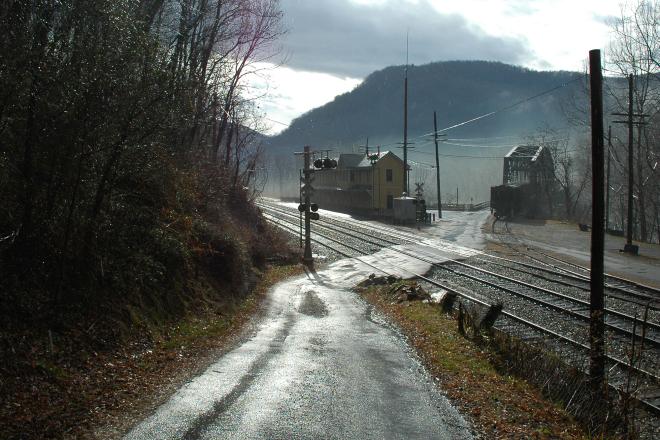Intersection of roads and railroad tracks in a small coal mining town.