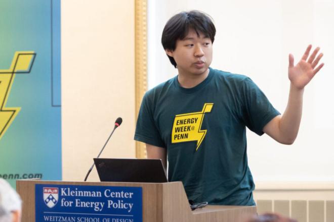 Student wearing an energy week shirt is pictured giving a talk during Energy Week in 2023.