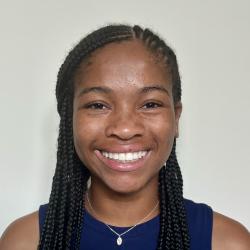 woman with dark hair and blue top